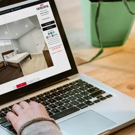 Woman using the state of the art Roomvo room visualizer to complete a flooring project.